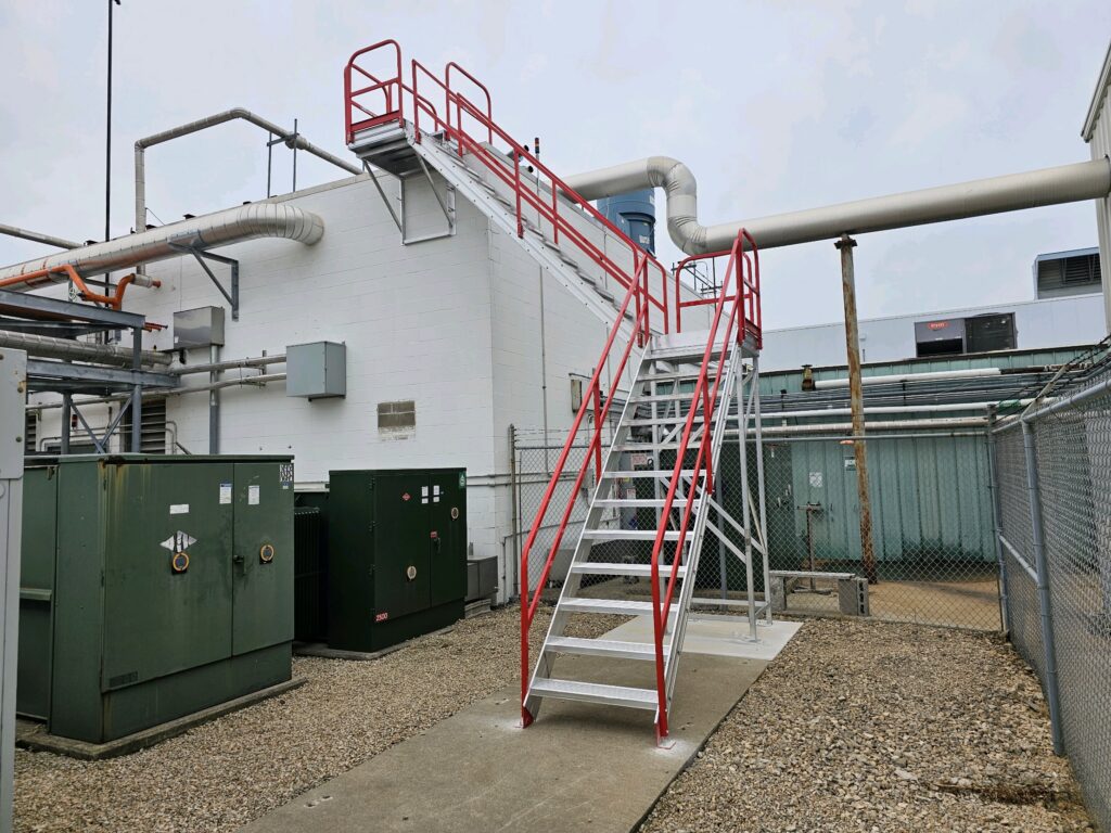 AdaptaStep exterior access stairs beside an industrial building.